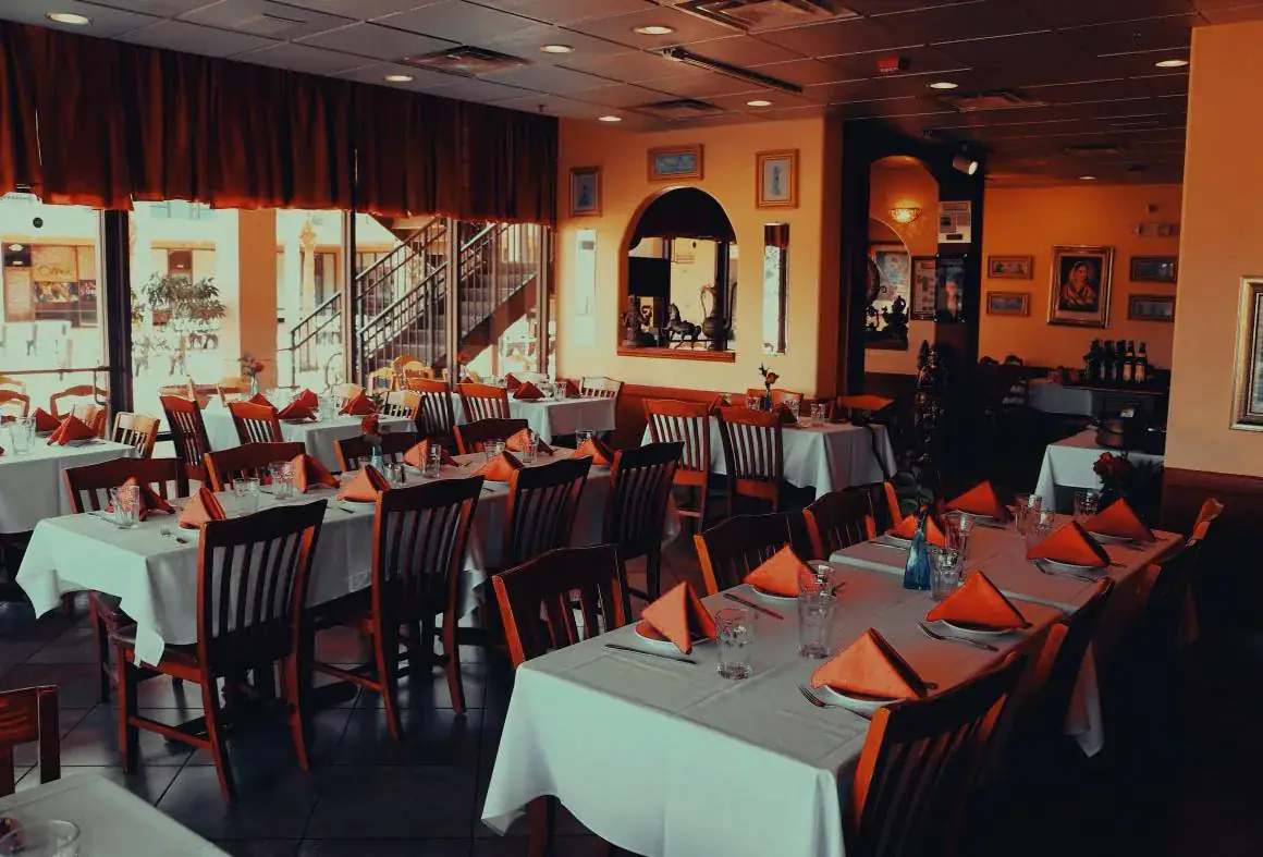 Inside Guru Indian Restaurant with dining chairs and tables